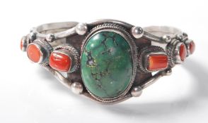 A stamped .925 silver bracelet bangle having beaded decoration to the clasp and is studded with
