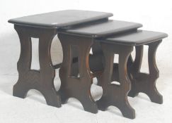 A contemporary 20th century Ercol Furniture beech and elm wood nest of tables in the Chaucer range /