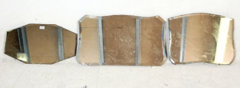 A group of three vintage retro mid Century frameless wall mirrors to include an octagonal example