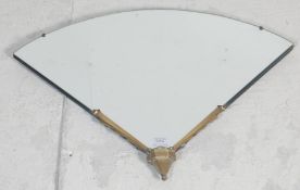 A 1930's Art Deco fan mirror of Odeon - theatre form. The fan shaped frameless wall mirror having