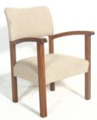 A vintage early 20th Century arts and crafts style upholstered bedroom / easy chair having white