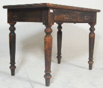 A 19th century Victorian mahogany table / desk, having two central drawers with swing handle