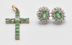 A pair of 9ct gold ladies emerald and diamond cluster earrings having oval cut emeralds having a