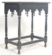 A 19th Century Victorian oak occasional / side table having a carved tabletop on a flared