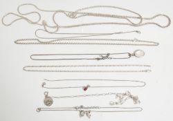 A group of mixed ladies silver necklaces to include a three chain popcorn necklace, a belcher link
