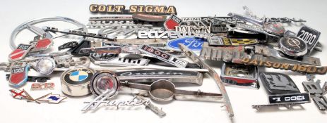 A good collection of vintage 20th century car manufacturer badges. To include Ford, Maxi, Morris