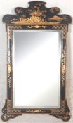 A 19th century ebonised chinoiserie black lacquer wall pier mirror. The rectangular mirror set