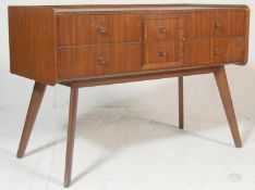 A retro mid century, Danish influenced walnut chest of drawers. Raised on tapering angular legs with