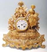 A early 20th century French brass spelter mantel clock having the typical french decoration to the