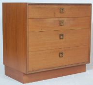 A vintage 20th century retro 1970’s teak wood chest of drawers. The chest having four graduated