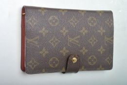 Louis Vuitton - An contemporary designer leather filofax having the iconic LV insignia to the