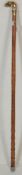 A late 20th Century gentleman's walking stick / cane. The walking stick having a brass bulldogs head