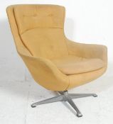 A vintage mid century retro Danish inspired egg chair  - easy swivel armchair. The chair being