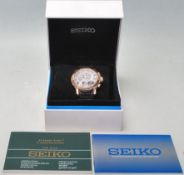 A cased Seiko gents Kinetic Chronograph wristwatch with rose gold plated case on stainless steel and