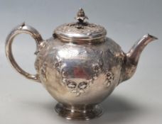 A 19th Century Victorian silver hallmarked Edward & John Barnard made teapot of round tapering