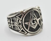A stamped 925 silver gentleman ring having the masonic symbol centre with number 32, eagle, and