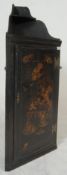 An 18th / 19th century black laquer Chinese chinoiserie decorated corner cabinet. The black ebonised