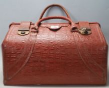 A good retro vintage 20th century large crocodile faux leather valise having brass lock, twin