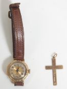 A vintage 9ct gold cased wrist watch having a gilt face with arabic numerals to the chapter ring and