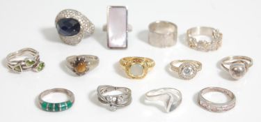 A group of ladies silver rings to include a statement crossover ring set with a large faceted