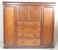 A Victorian 19th century mahogany triple wardrobe compact. Raised on a plinth base with twin
