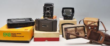 A group of vintage early 20th century photograph cameras to include brown box cameras and  folding