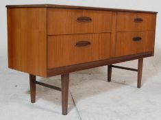 A good vintage retro 20th century G plan teak wood sideboard having a bank of four drawers raised on