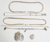 A group of vintage silver necklaces to include a three tone plaited flat link necklace, a flat