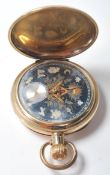 A 20th Century Masonic gold plated pocket watch having a round face with a black ground having