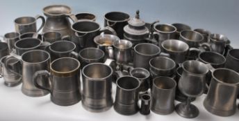 A large collection of pewter tankards dating from the 19th century to include many examples,