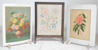 A group of three 20th Century fire screens to include a 1930's oak framed needlework example with