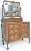 A 1920's Jacobean revival oak dressing table chest. Raised on barley twist legs with a series of