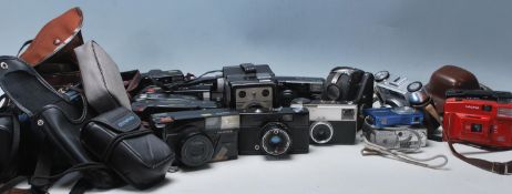A collection of late 20th Century cameras to include Coronet Ambassador, Canon, Ricoh Halina,