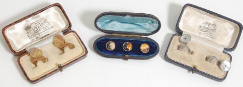 A group of three vintage gentleman's boxed cufflinks and studs to include a pair of silver mother of