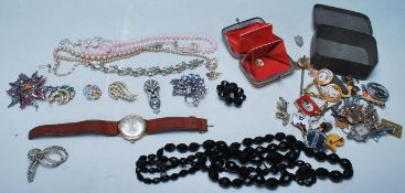 A good collection of 20th century costume jewellery and watches to include necklaces brooches,