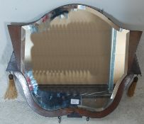 A 1930's Art Deco fan wall / overmantel mirror. The bevelled edge mirror plate in unusual stepped
