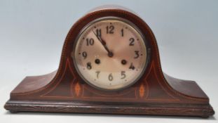 An Edwardian early 20th Century mahogany inlaid Napoleon's hat mantel clock by Baldwin & Gillett.