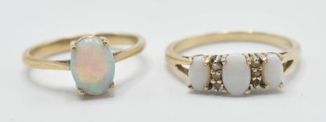 Two stamped 375 9ct gold rings to include one ring prong set with an oval opal cabochon (marked 375,
