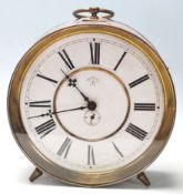 A vintage retro 20th Century Junghans Trade Mark ship style clock having a round white enamelled