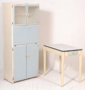 A retro vintage mid century 1950s kitchen cabinet and table set by County in a blue and white