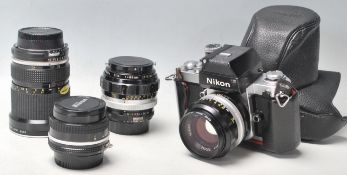 A vintage Nikon F2 camera No: 7460757 with NIKON NIKKOR S C Auto 1:1.4 f=50mm lenses No. 1550356
