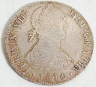 An 1810 Fernando VII 8 Reales silver coin – Ferdin VII Dei Gratia 1810 – translates Fernando the 7th