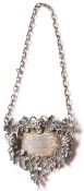 A silver hallmarked Port label having raised and cast grape vine decoration surrounding an