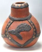 A large mid century vintage Australian Aboriginal tribal gourd / water vessel in ochre and black