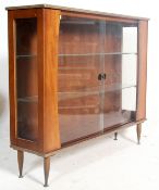 A retro vintage 1960s teak wood china display vitrine bookcase cabinet having glazed double doors