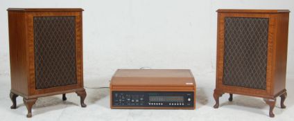 A vintage Dynatron SRX 30C table top record player and tuner having teak wood case with hinged lid