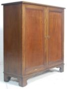 A Victorian 19thcentury mahogany estate cupboard – library bookcase cabinet. Raised on plinth base