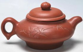A 20th Century Chinese Yi Xing red clay teapot rai