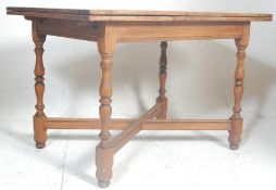 An early 20th century mahogany turned refectory dr