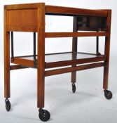 MID CENTURY TEAK TWO TIER REVOLVING TEA / COCKTAIL TROLLEY